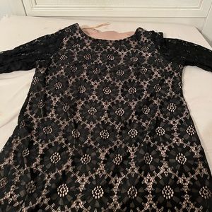 Black dress with cut out nude behind it